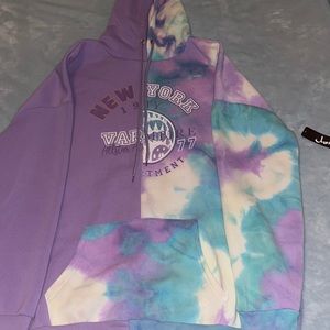 Never worn justify women’s hoodie purple, white, and light blue size Large.